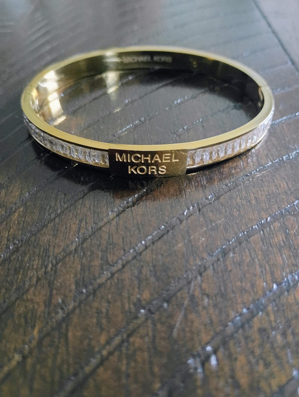 New Gold Tone and Clear Crystal Logo Bangle